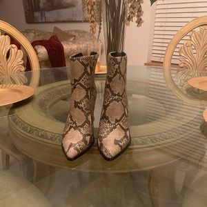 Black/white snake print leather boots